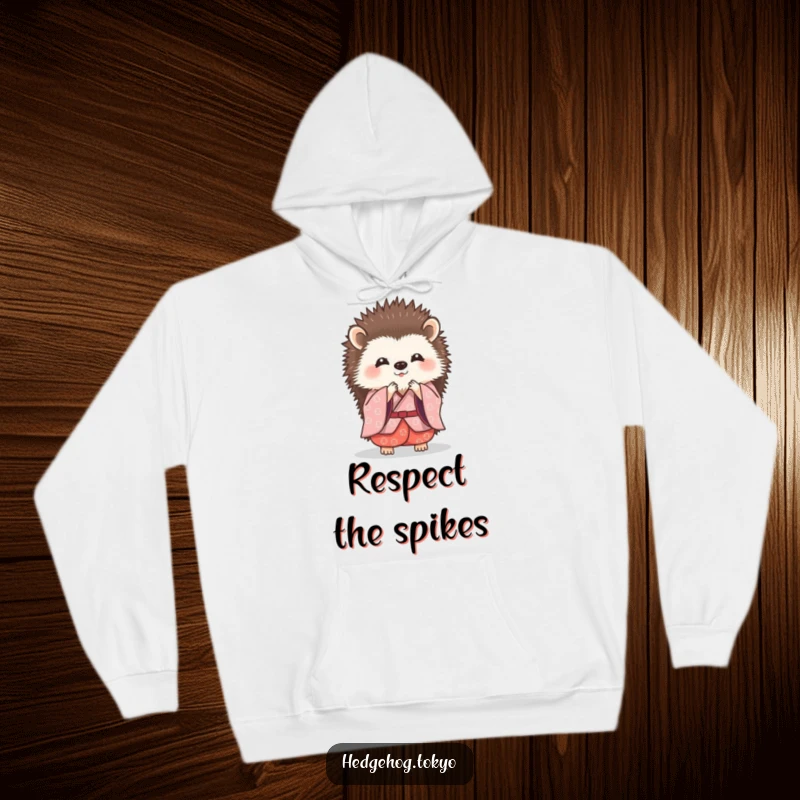 Funny hedgehog in a traditional kimono doing a tiny, graceful bow, depicted on a warm and cozy hoodie.