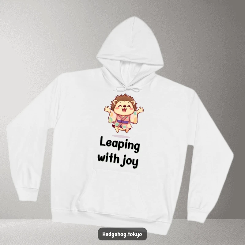 Funny hedgehog hoodie featuring a cheerful hedgehog in a colorful kimono joyfully leaping mid-air, offering warmth and a dose of pure happiness.
