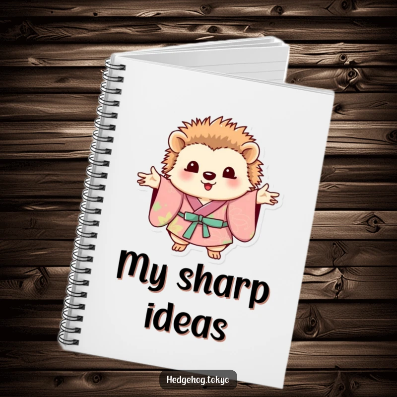 Funny hedgehog wearing a vibrant kimono, posing with outstretched paws on the cover of a stylish notebook.