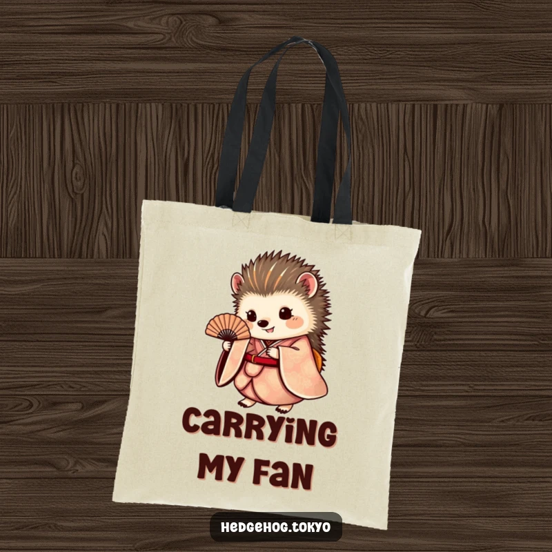 Funny hedgehog tote bag showcasing a round hedgehog in a flowing kimono holding a fan, perfect for carrying essentials with elegant charm.