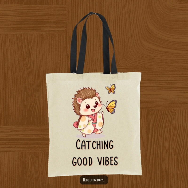Funny Tote Bag: A delightful hedgehog in a kimono energetically pursues a butterfly, embodying playful adventure and lighthearted joy.